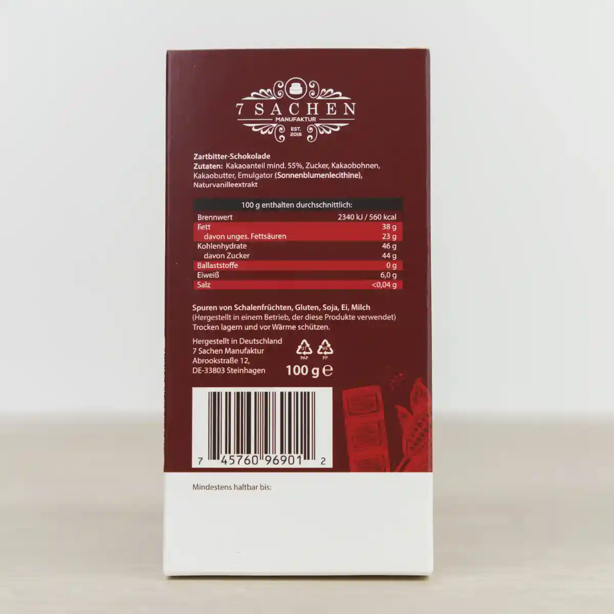 Handgegossene Zartbitterschokolade mit 55 % Kakaoanteil – mild & harmonisch, von der 7 Sachen Manufaktur in Steinhagen. Rückseite.