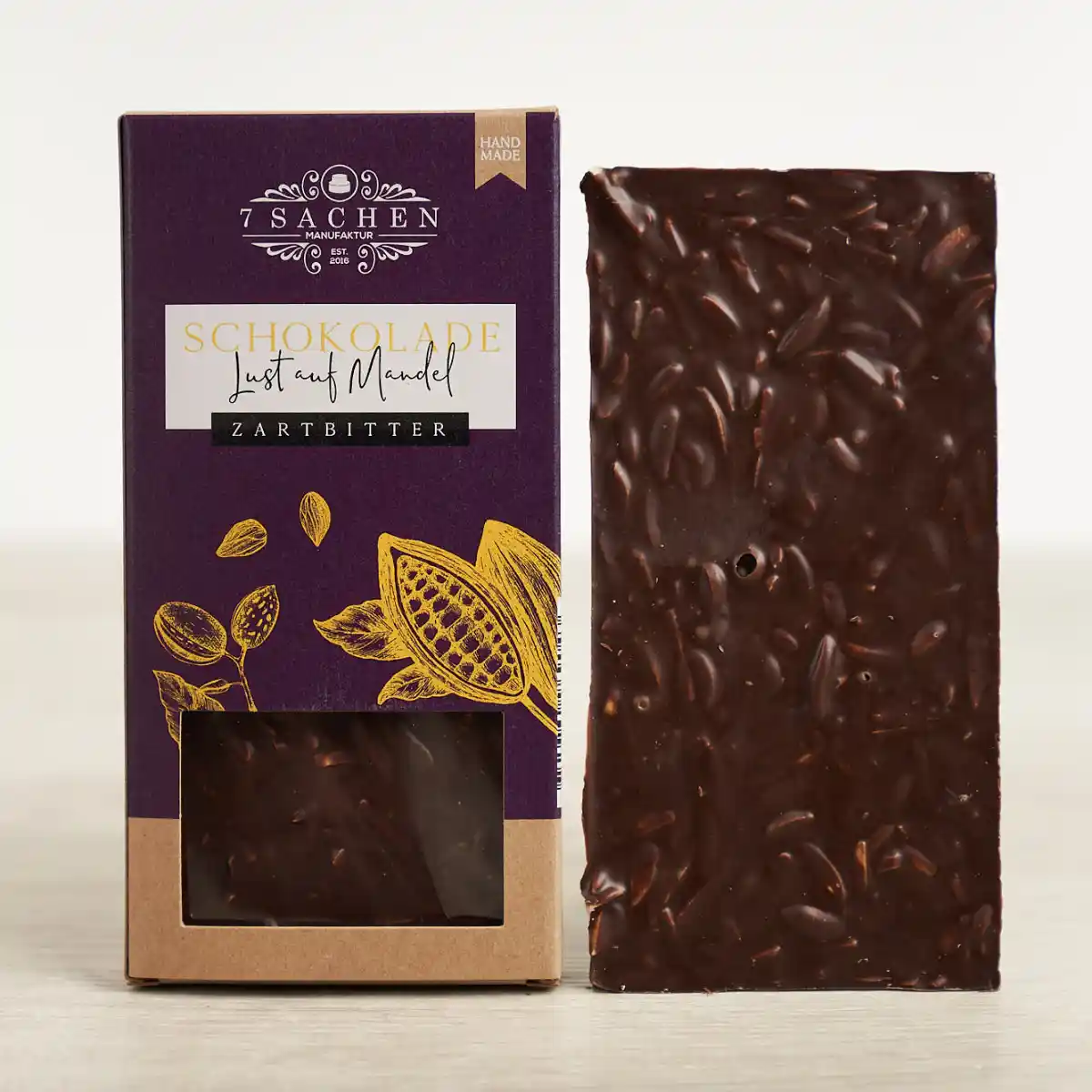 Handgegossene Zartbitterschokolade 55 % mit Mandeln – edel & knackig aus Steinhagen.