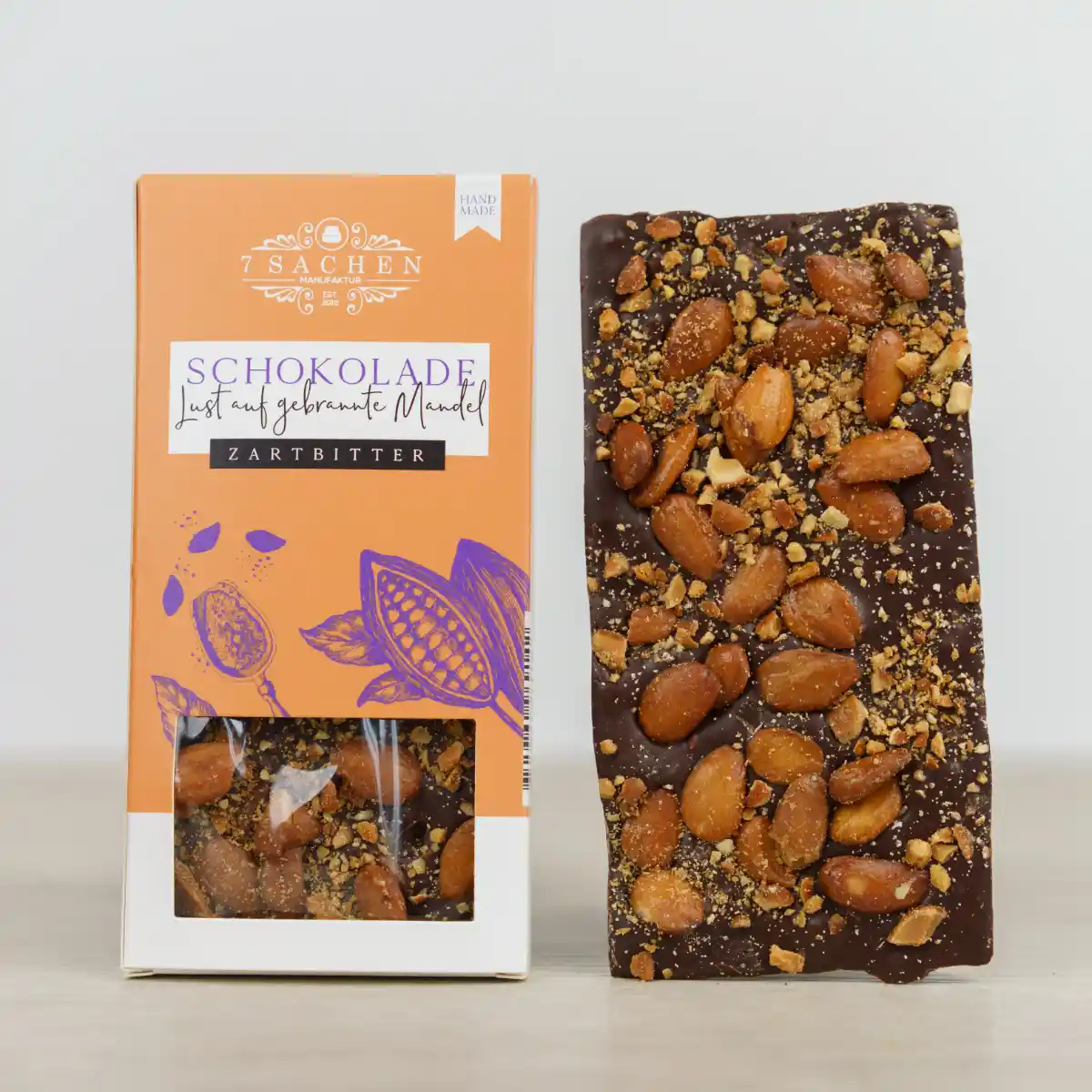Handgegossene Zartbitterschokolade 55 % mit gebrannten Mandeln – knusprig & golden geröstet aus Steinhagen.
