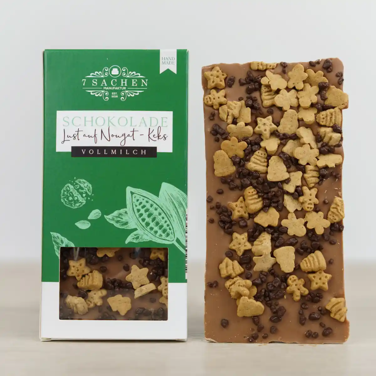 Handgegossene Vollmilchschokolade mit Nougat & Butterkeks – zart & knusprig, aus Valrhona-Couverture, handgefertigt in Steinhagen. Weihnachtsedition