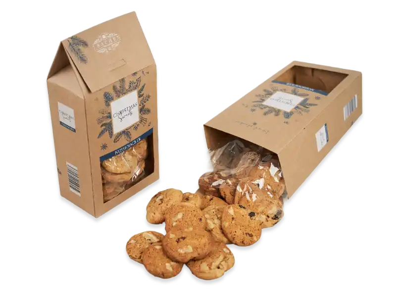 Knusprige Kekse von 7 Sachen Manufaktur in nachhaltiger Kartonverpackung, mit Sichtfenster und winterlichem Design.